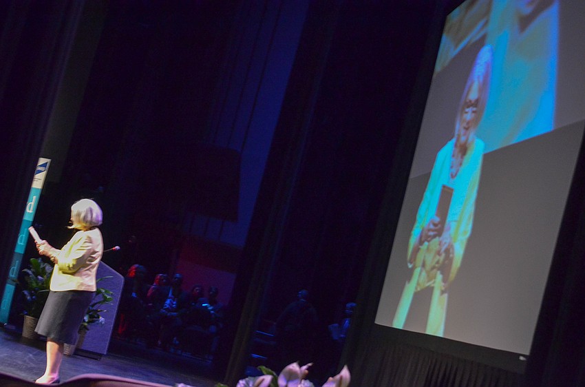 Kristine Nickel, President of the Ringling College Library Association, speaks prior to Bush's introduction.