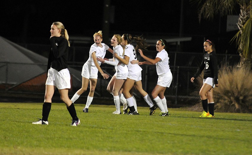 The Lakewood Ranch High girls soccer team celebrates following freshman Sophia Falcoâ€™s goal seven minutes into the match.