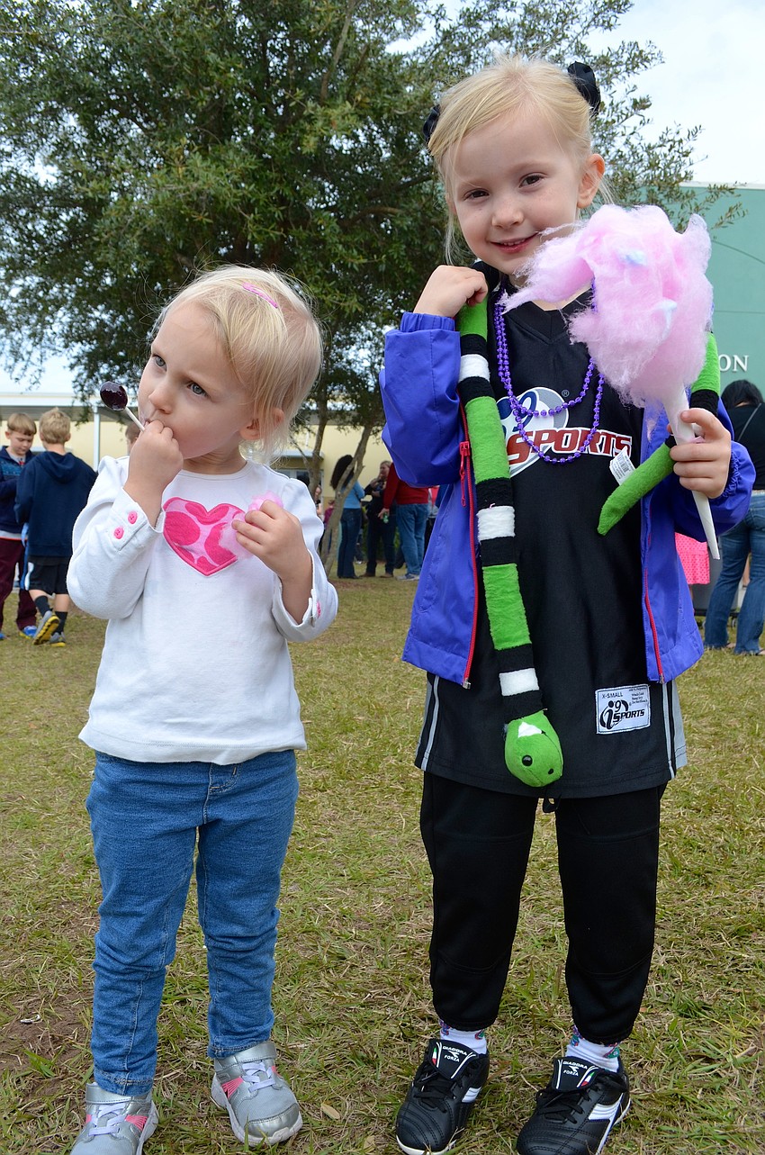 The Harris sisters â€” Emily, 3, and Olivia, 5 â€” enjoy sweet treats.