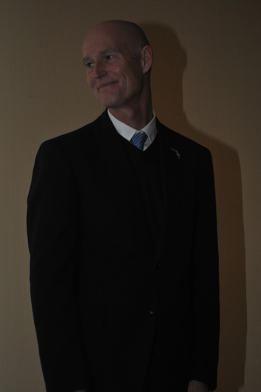 Gov. Rick Scott soaked in the applause after he spoke.