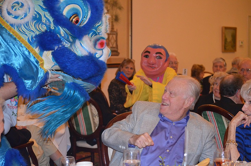 Harvey Rothenburg jokes around with the lion.