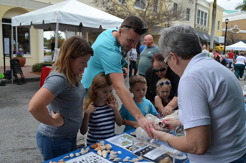 Megan, Emily, Elijah and Cohen Cope at the Mote Marine Aquarium booth