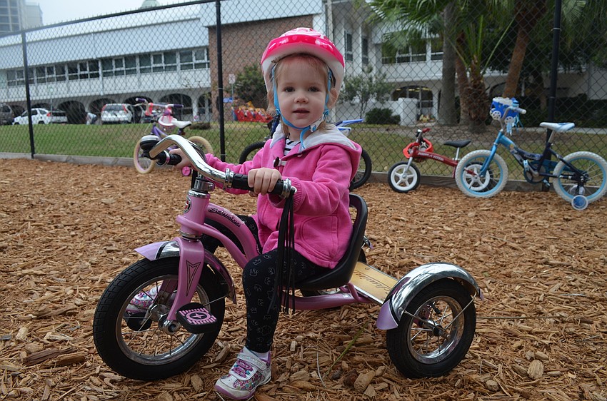 Ava Hayes brought her tricycle from home.