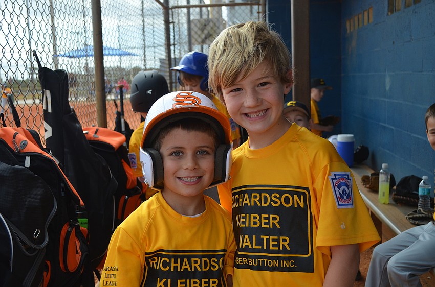 Keller Button and Jaxon Smith hang out between innings.