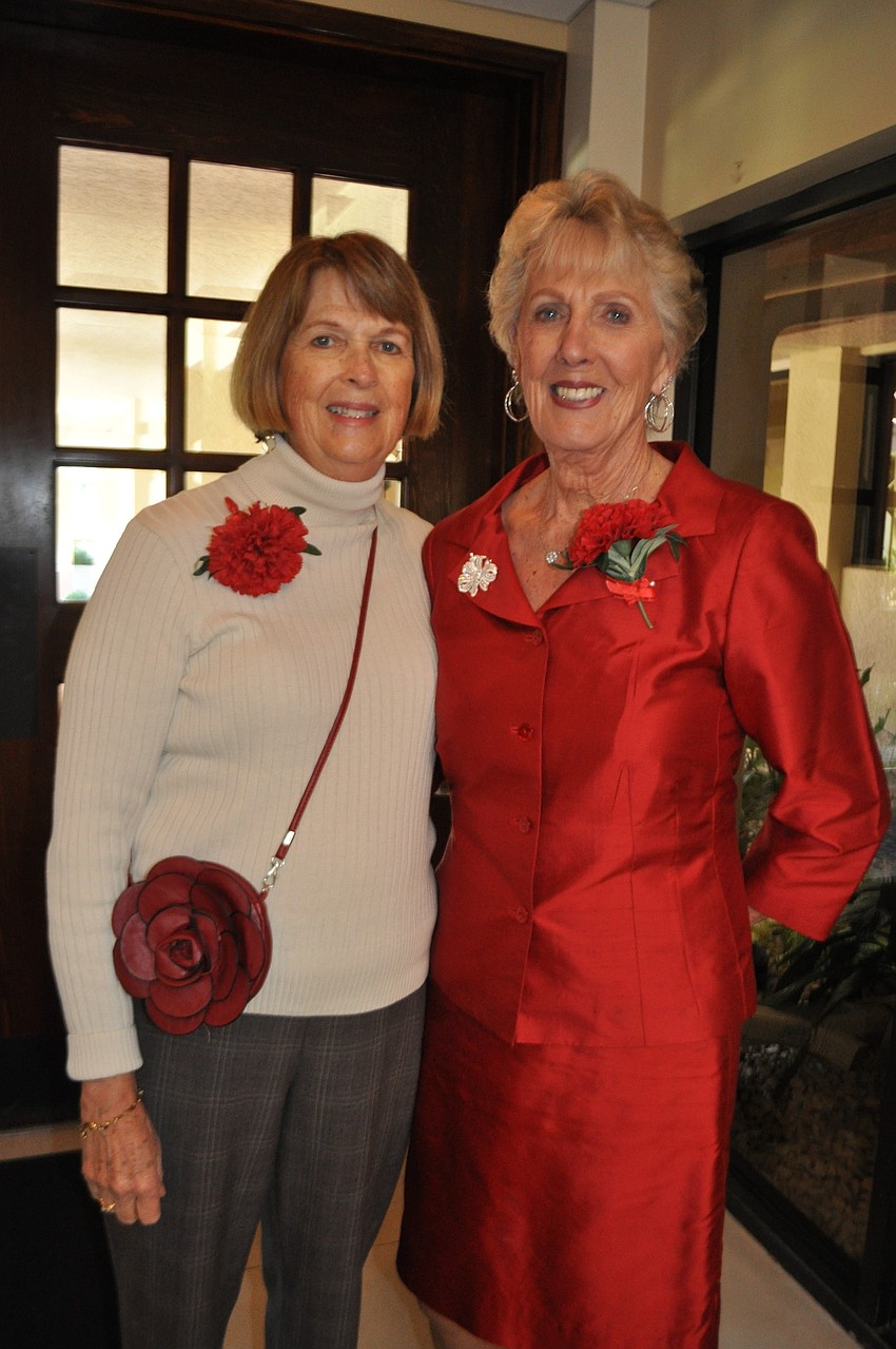 Barbara Saabye and Georgia Chapman greet guests.