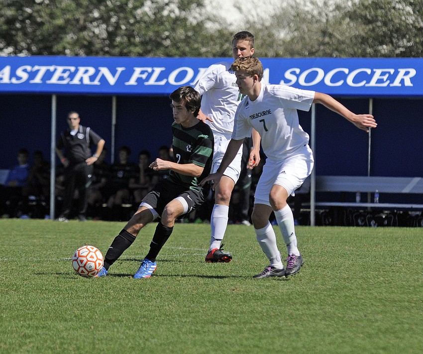 Lakewood Ranch midfielder Felipe Dangond dribbles the ball past a Melbourne defender in the first half.