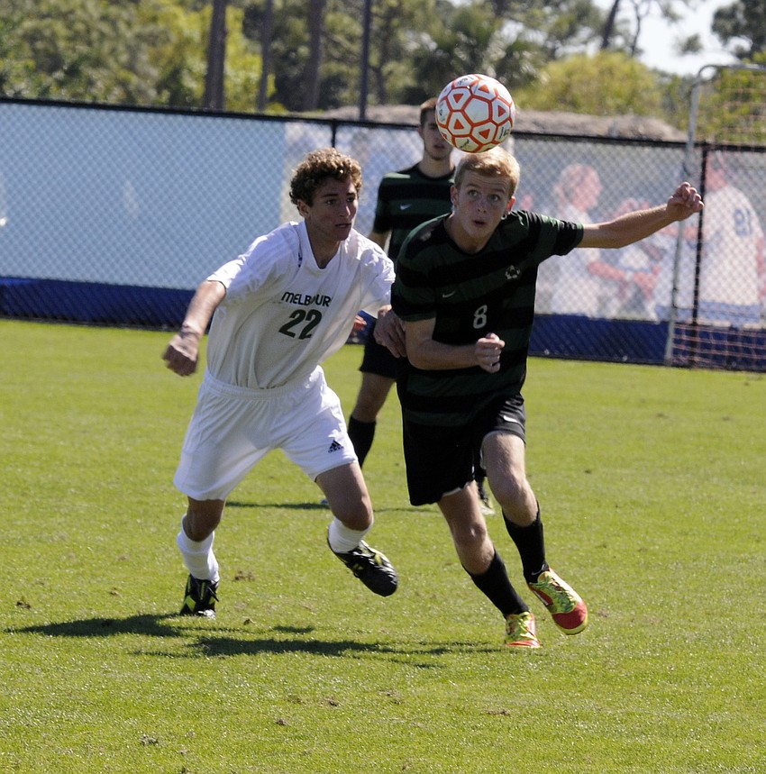 Lakewood Ranch midfielder Ben Wilson battles a Melbourne defender for possession in the second half.