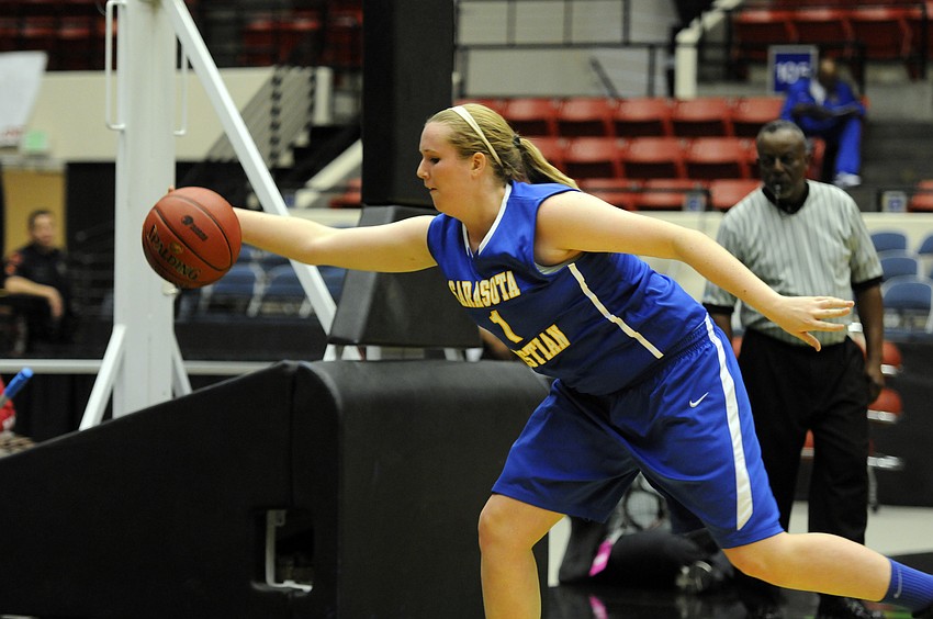 Sarasota Christianâ€™s Anikka Jensen attempts to save the ball before it goes out of bounds.