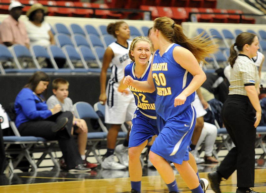 McKenzie Lantz and Heidi Miller celebrate following Sarasota Christianâ€™s 68-59 victory over Academy at the Lakes in the FHSAA Class 2A state semifinals Feb. 18.