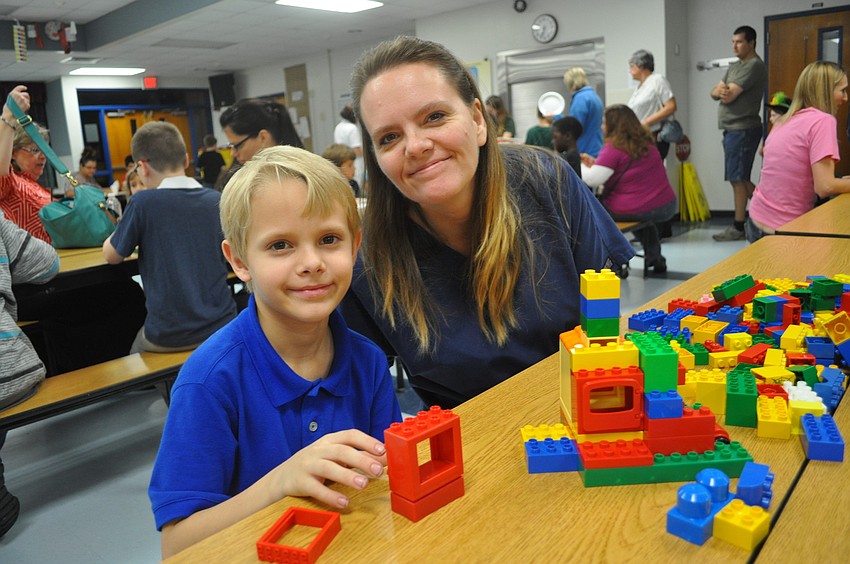 Annette Price and her third-grade son, Terry, built a house to hold cars.