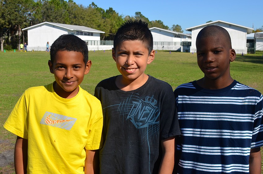 Eleven-year-olds Edy Sorto, Eduardo Santamaria and Theodore Lang enjoy time with friends.