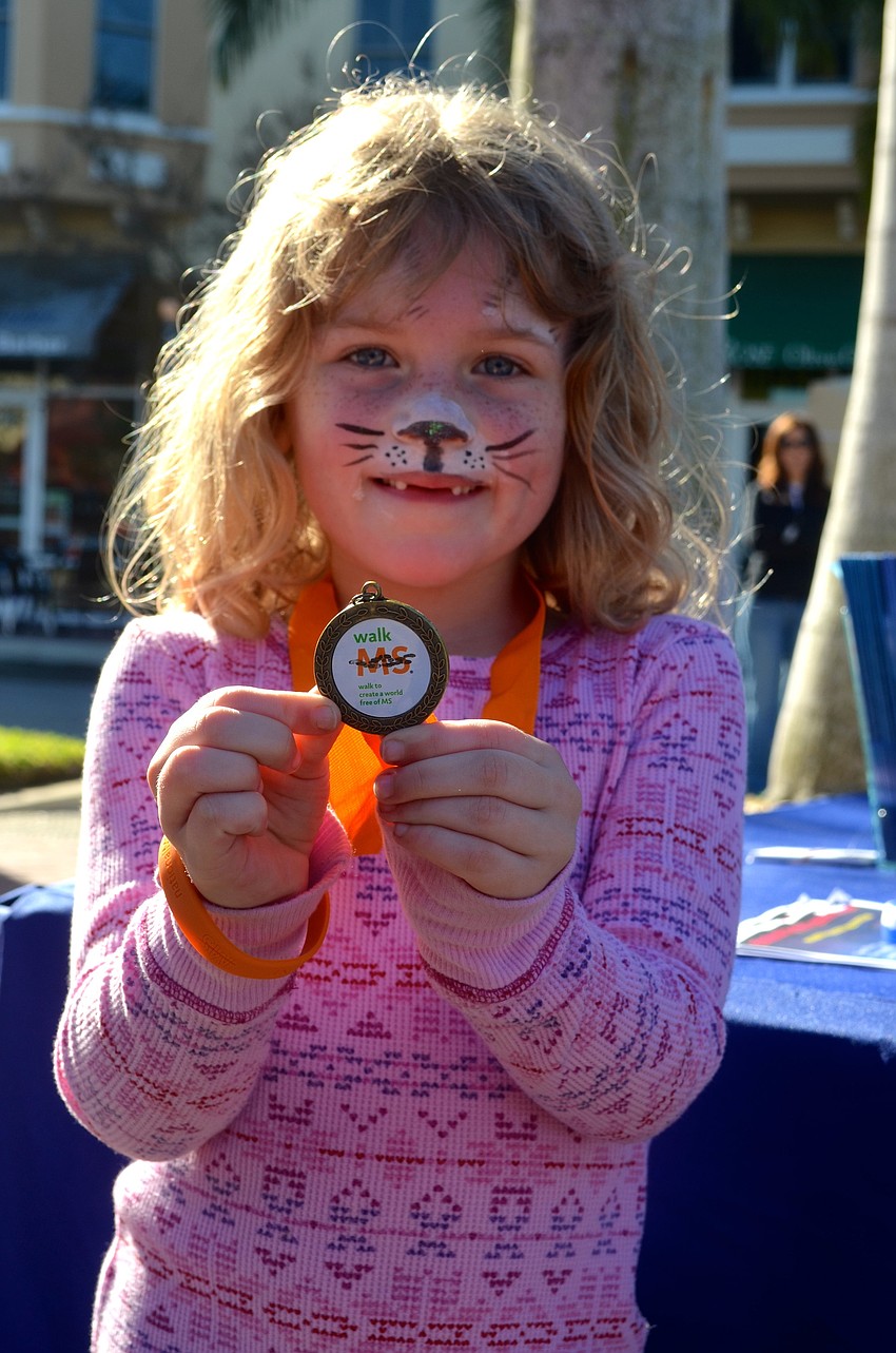 Ashlyn Berdux, 6, takes home a medal.