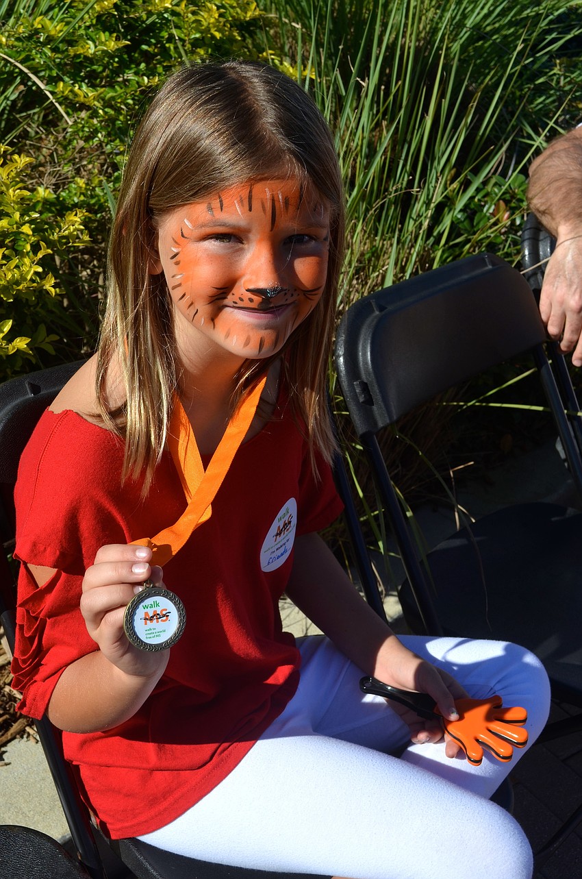 Nine-year-old Iris Tufano shows her pride, with tiger face paint.