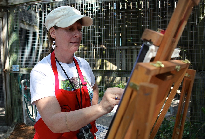 Sharon Guy paints the Barred Owls at Save Our Seabirds during the festival.