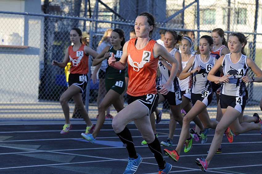 Sarasotaâ€™s Emily Harding jumps out to an early lead in the 1600-meter run, which she won in 5 minutes, 10.22 seconds.