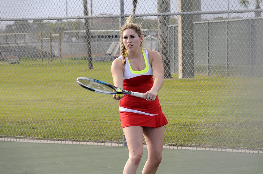 Cardinal Mooney freshman Erica Lester prepares to serve during her No. 4 singles match.
