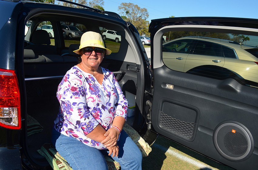 Edit Szegedi enjoys tailgating in the shade.