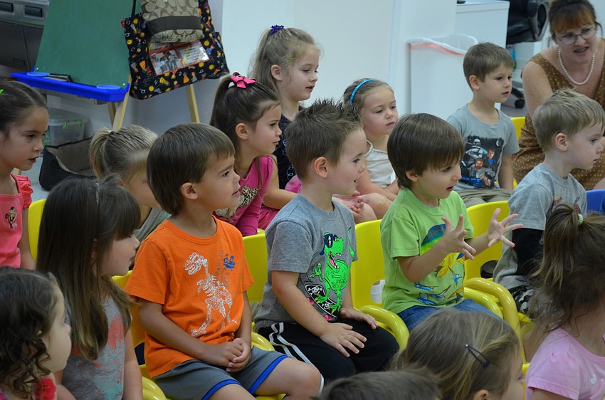 Students, ages 2-5, learn about different reptiles and amphibians.