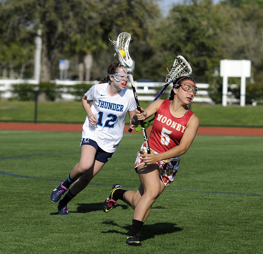 Cardinal Mooney midfielder Raquel Cartaya brings the ball up the field.