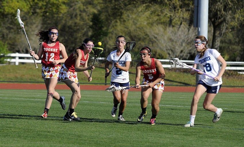 Cardinal Mooneyâ€™s Noel Turner looks to maintain possession for the Lady Cougars.
