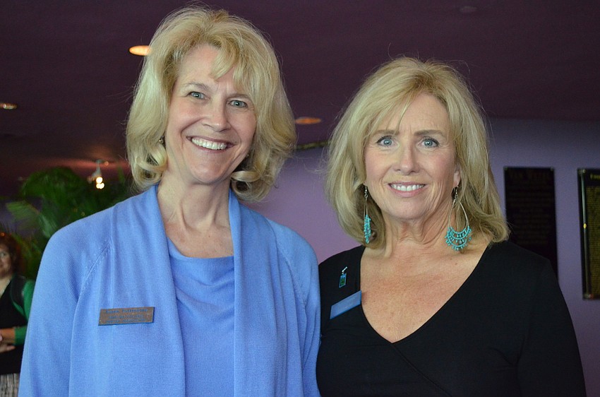 Rincling College Library Association President-Elect Karen Eastmoore and Chris Cremer