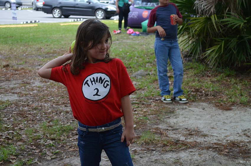 Mia Amdur throws a ball at the dunking tank.