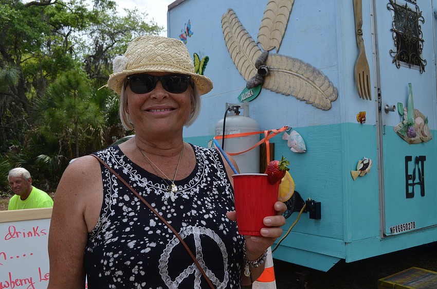 Debby Getch cools off with a smoothie.