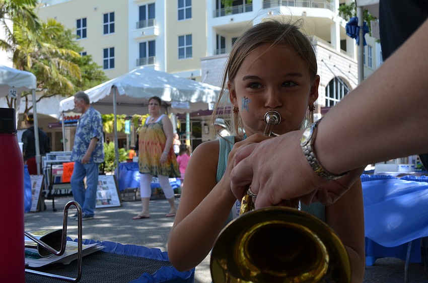 Meli Gonzalez plays the trumpet.