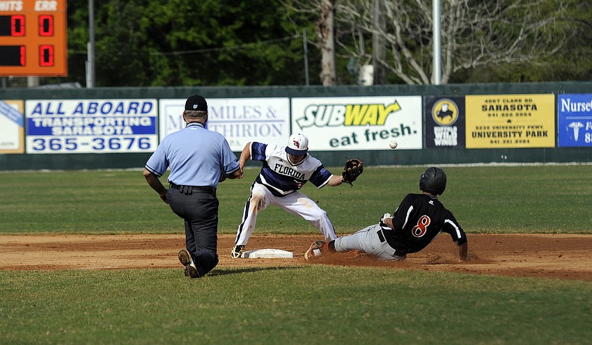Sarasota High shortstop Evan Mendoza slides safely into second base in the bottom of the first inning versus Florida Christian March 26.