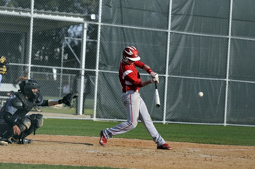 Cardinal Mooney senior Robby Shay makes contact during the Cougars game against Miami Springs March 26.