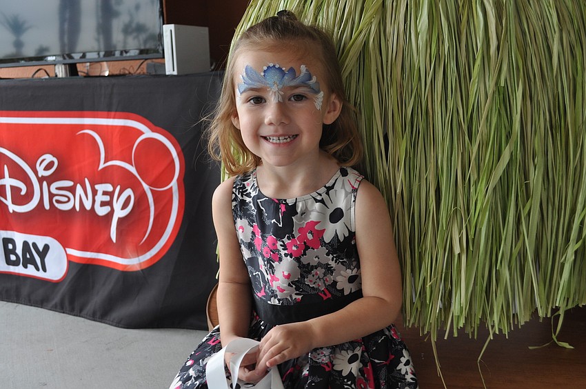 Addison Crutchfield, 3, enjoys entertainment by Radio Disney.