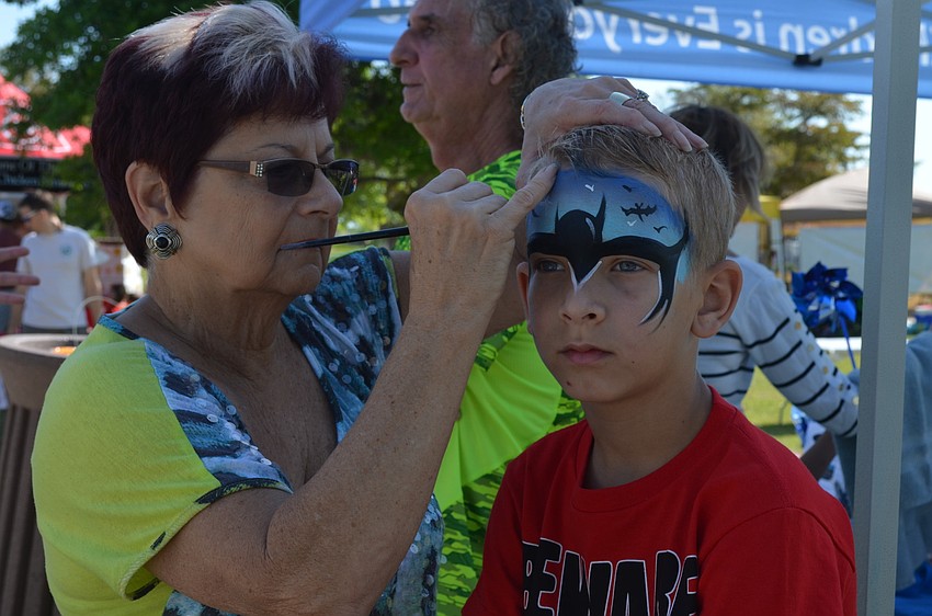 Zack Caldwell has his face painted.