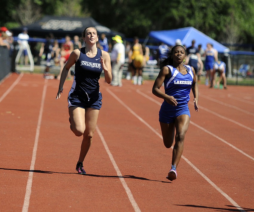 ODAâ€™s Emma Young looks to break past a Lakeside Christian runner down the stretch of the 100-meter dash.