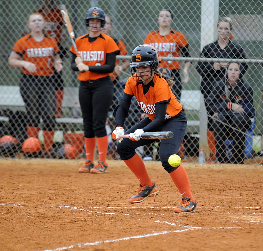 Sarasotaâ€™s Kourtney Linn puts down a bunt in the top of the first inning.
