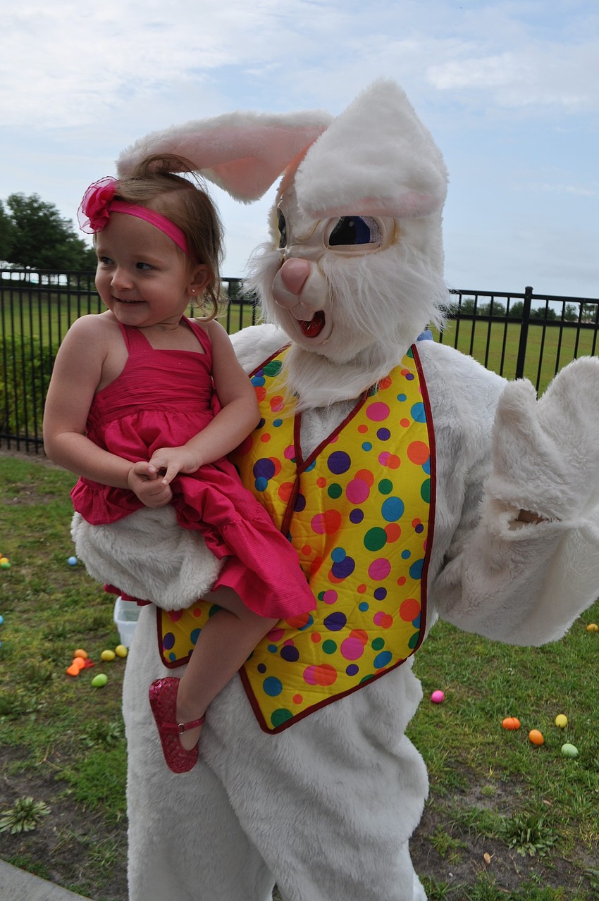 Josefina Pouso claps with glee before giving the Easter Bunny a hug.