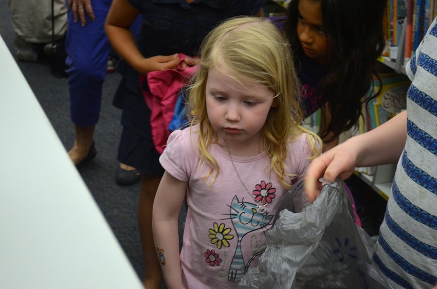 Alex Bell hunts for candy-filled eggs.