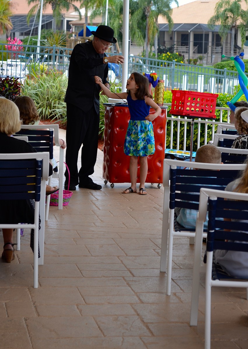 Corrinna LaPlume assists Stevie the Magician during his show.