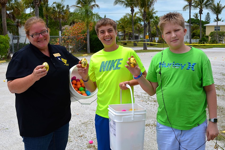 DeEtt Bailey, Dylan Joseph and Collin Hicks hide special eggs before the hunt.