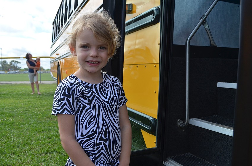 Maya Andreu waits to board a school bus.