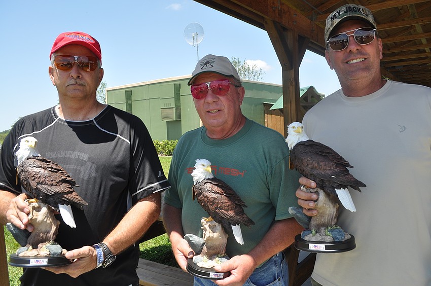 The winning shooters: East Manatee Fire Rescue Chief Byron Teates with Ken Patton and Steve Trompke