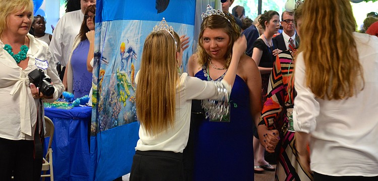 Caitlin Pfeifle receives a tiara to wear for the evening.