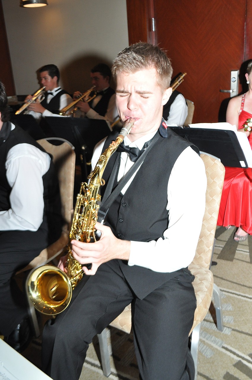 Hunter Reed and fellow members of the schoolâ€™s jazz band played for guests as they arrived at prom.