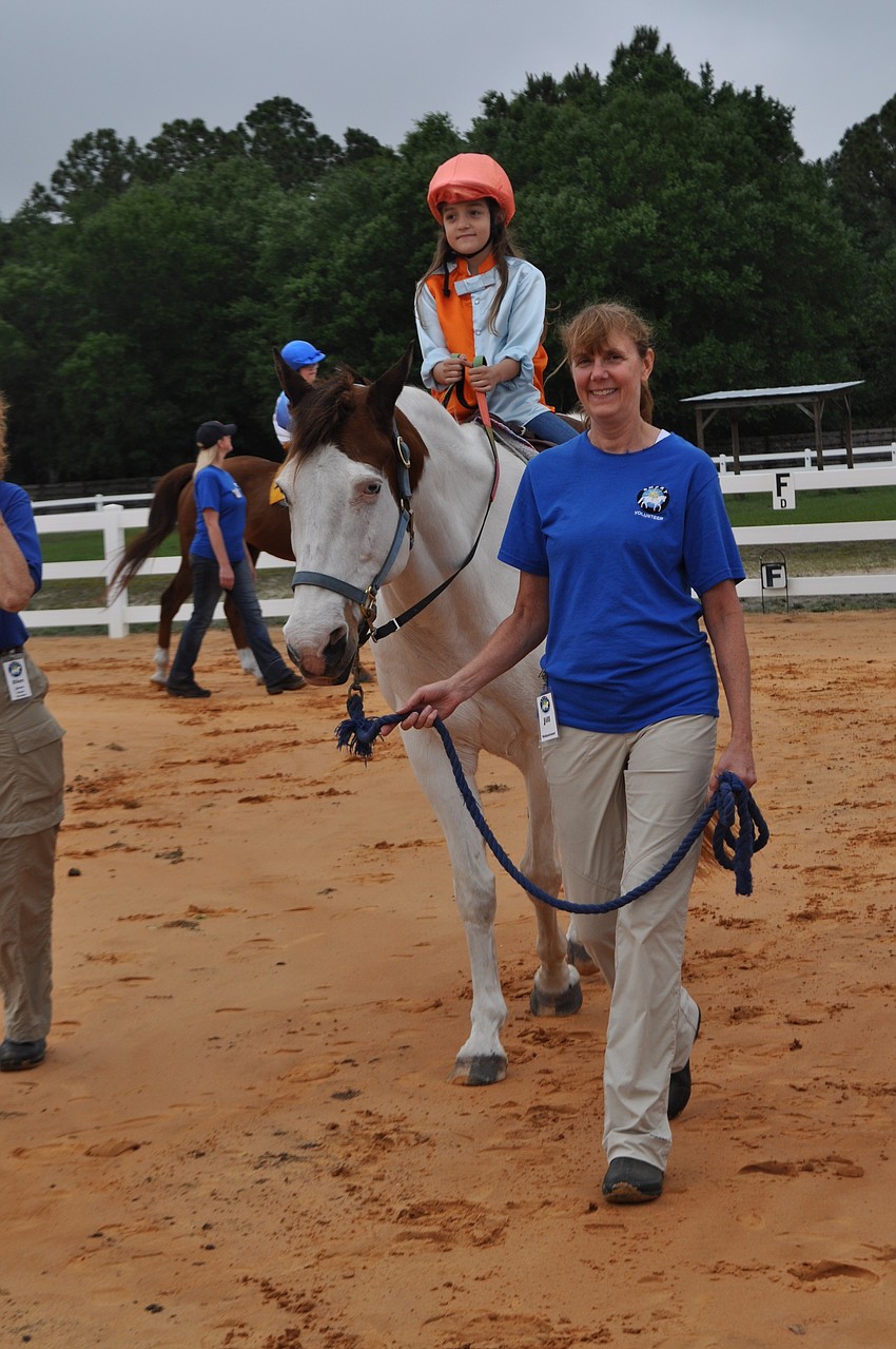 Natalie Norman, on P.J., shows off her riding skills.