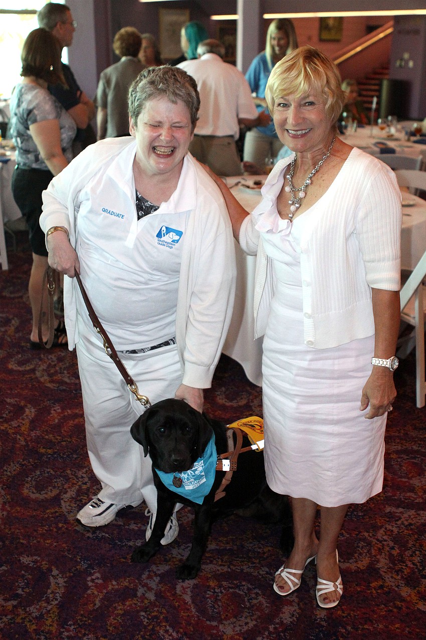 Deena Keck with her new guide dog, Annie, and Annieâ€™s sponsor Anne Brown. Annie was the only dog in the 218th class to be raised in Sarasota.