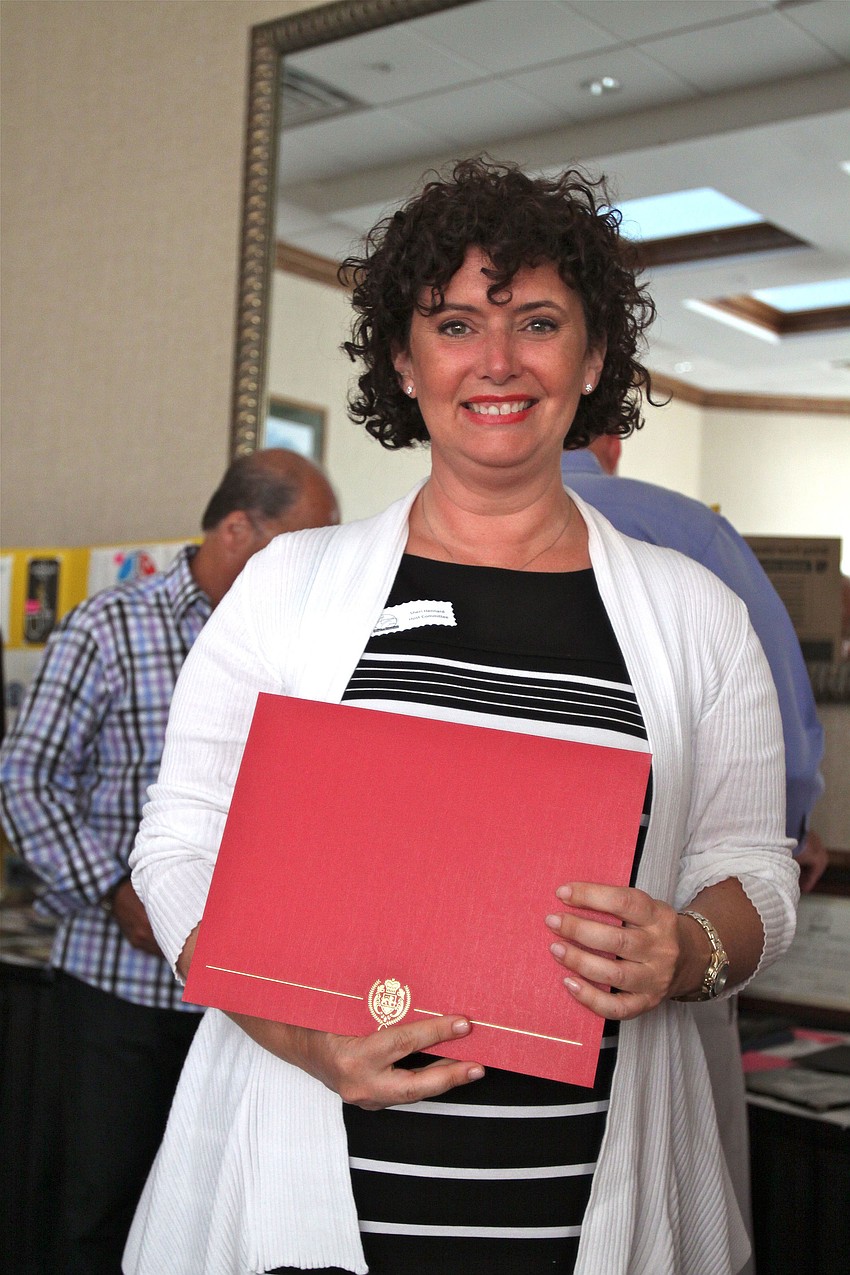 Sherri Aiello was given a certificate of appreciation for her portrayal of Mrs. Claus in the Holiday Party parade.