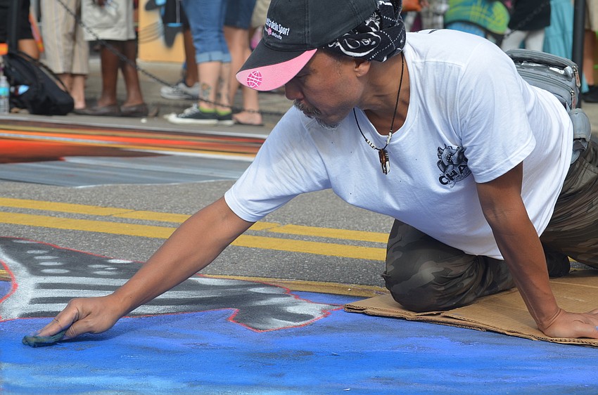 Tomoteru Saito works on his piece