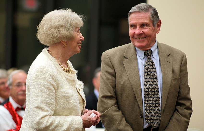 Ginny and the Rev. Bruce Porter smile at each other as they receive a few gifts from the congregation.