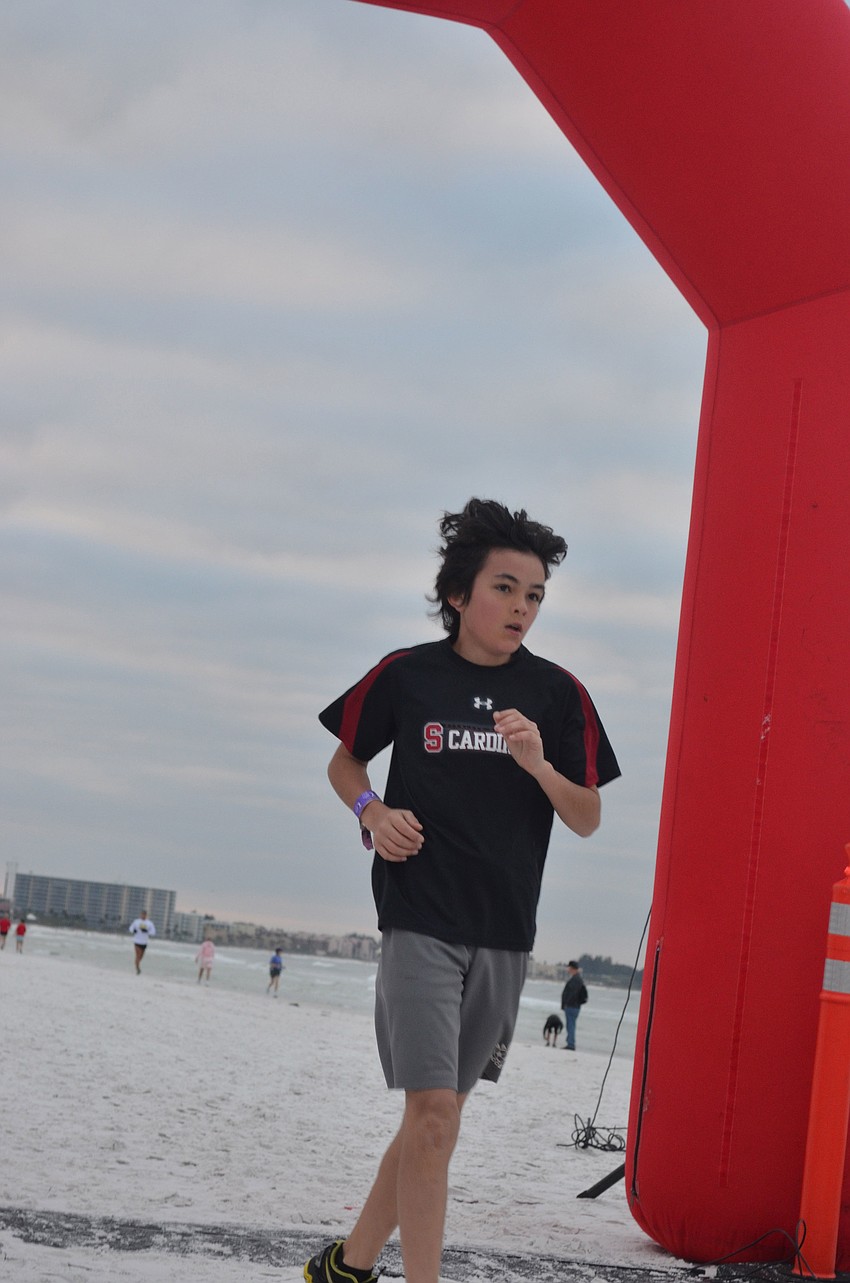 Garrett Starschnov was the first to finish the 1 â€“ mile â€“ fun â€“ run with a time of 6:14.