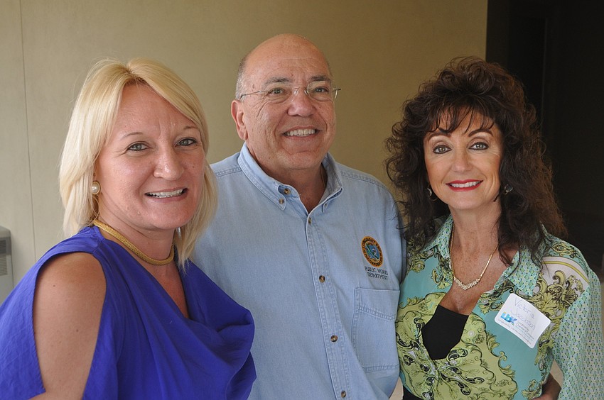 Dawn Mims and Victoria Jacobson of the Longboat Key Chamber of Commerce with Public Works Director Juan Florensa, center