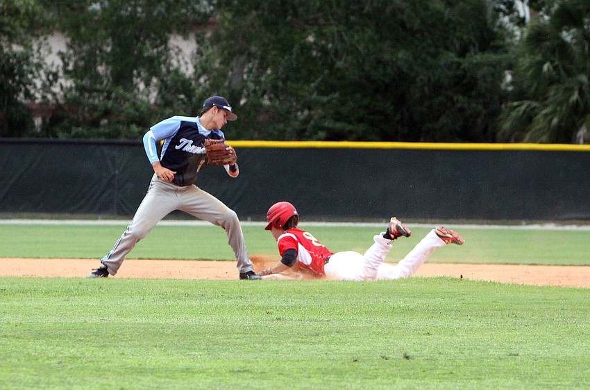 Out-of-Door Academyâ€™s Jimmy Kuebler, No. 2, tries to tag out Cardinal Mooneyâ€™s Beau Billings, No. 8, as Billings slides into second.